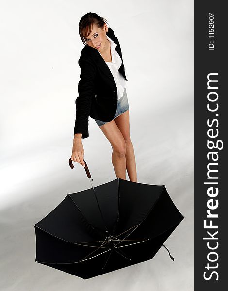 A model posing with umbrella - Studio Shot