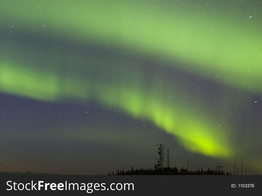 Northern lights over antenna complex on the hilltop. Northern lights over antenna complex on the hilltop