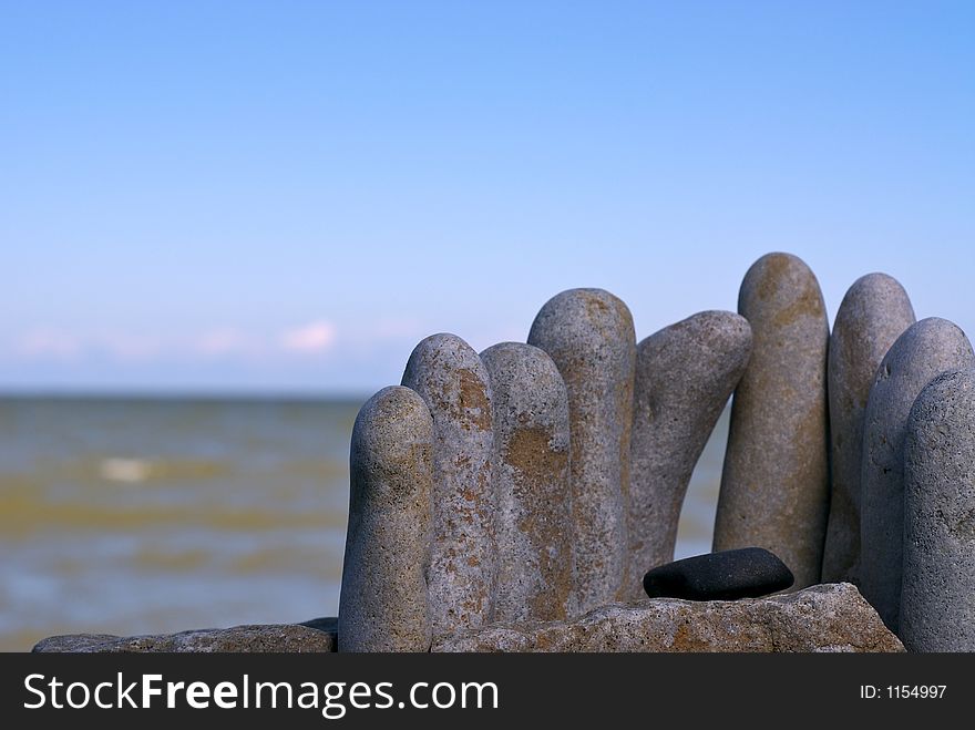 A stack of stones on a beach. A stack of stones on a beach