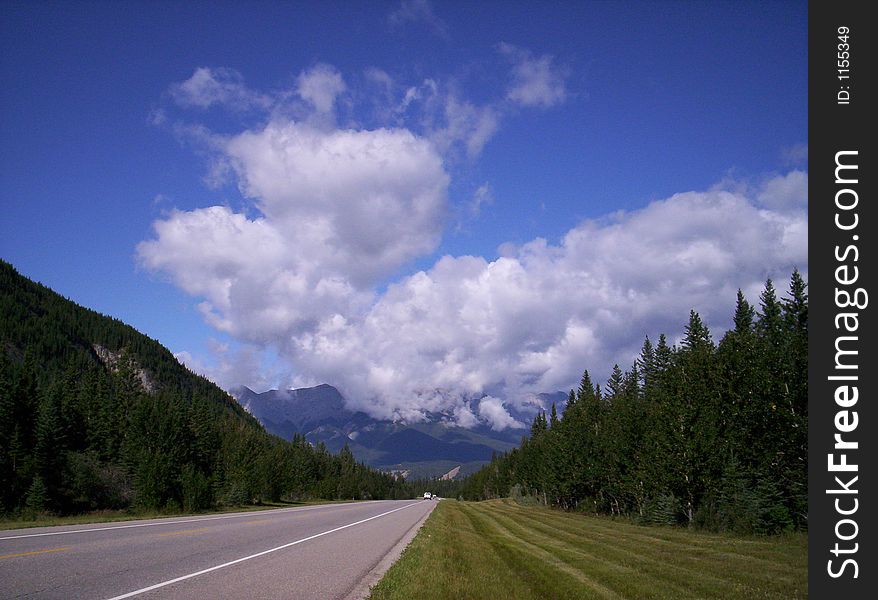 Highway shot taken in the foothills with the Rocky Mountains in the distance. Highway shot taken in the foothills with the Rocky Mountains in the distance.