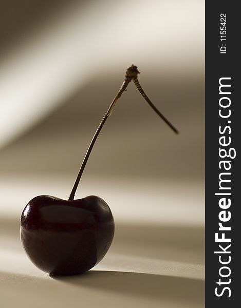 Isolated cherry against a dramatic background. Isolated cherry against a dramatic background