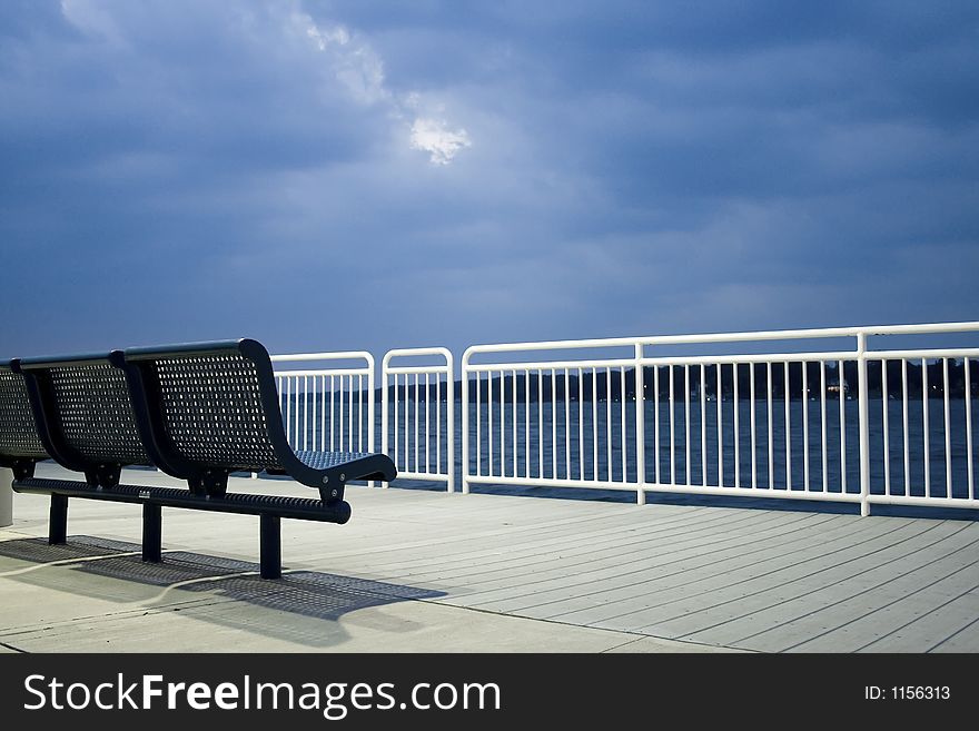 View of a walkway overlooking a channel of water. View of a walkway overlooking a channel of water.