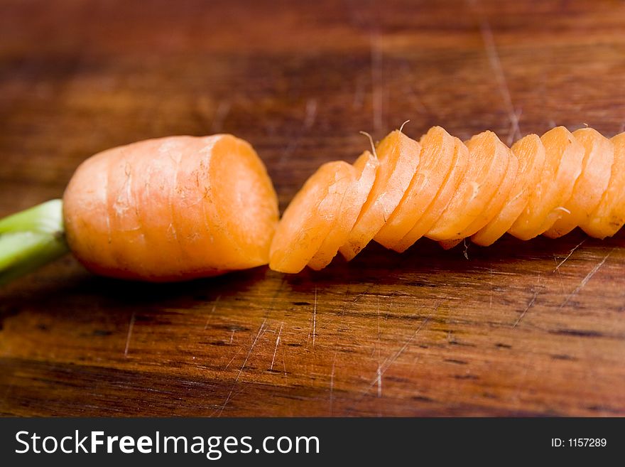 Chopped up carrot on a chopping board. Chopped up carrot on a chopping board