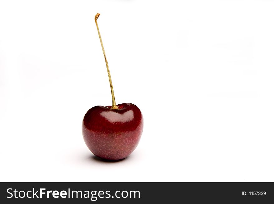 Isolated perfect juicy red cherry
