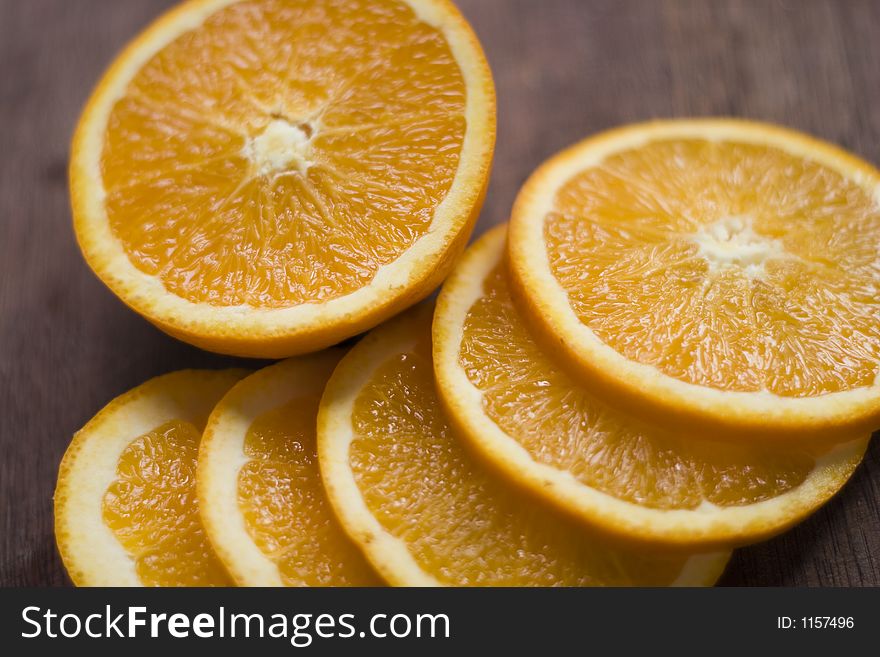 Sliced orange on a wooden surface