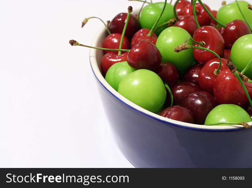 Cherries and plums in white background. Cherries and plums in white background
