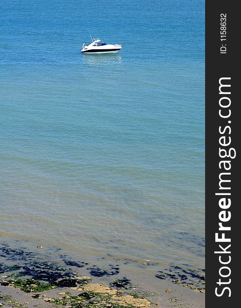 Luxury motorboat yacht moored off the coast at sea. Luxury motorboat yacht moored off the coast at sea