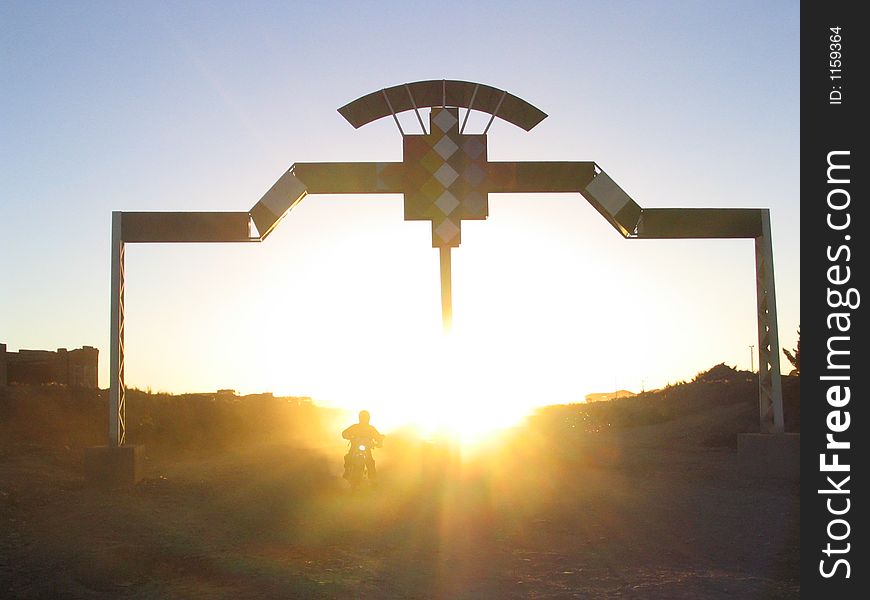 Crossing the gate in the sundown. Crossing the gate in the sundown