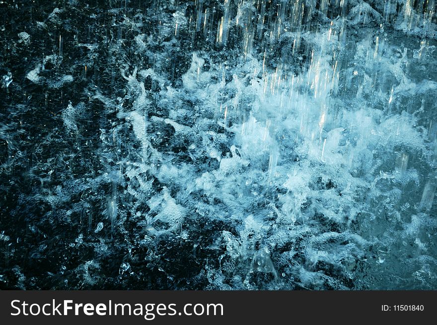 Water splashes from a public fountain.