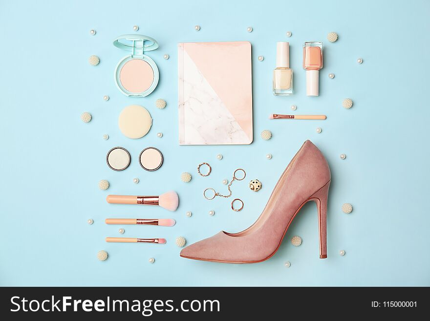 Flat lay composition with cosmetics and stylish accessories on color background