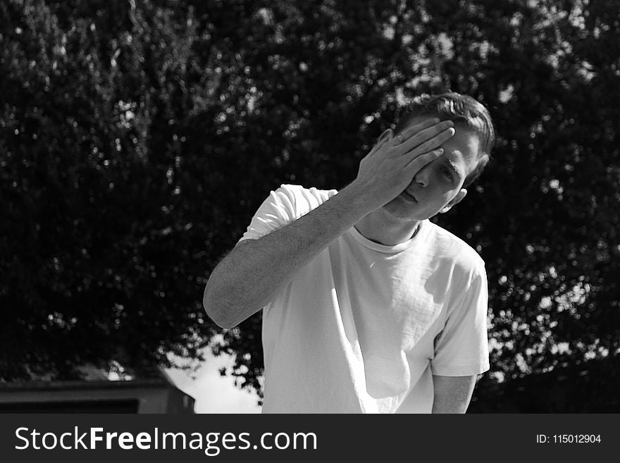 Grayscale Photo Of Man Wearing White Crew-neck Shrit