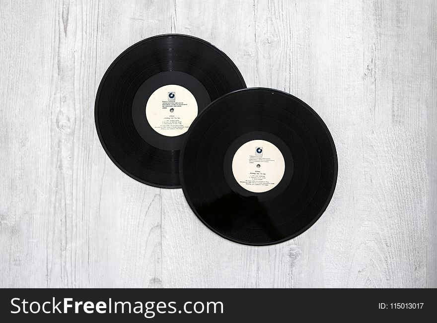 Photography of Vinyl Records On Wooden Surace