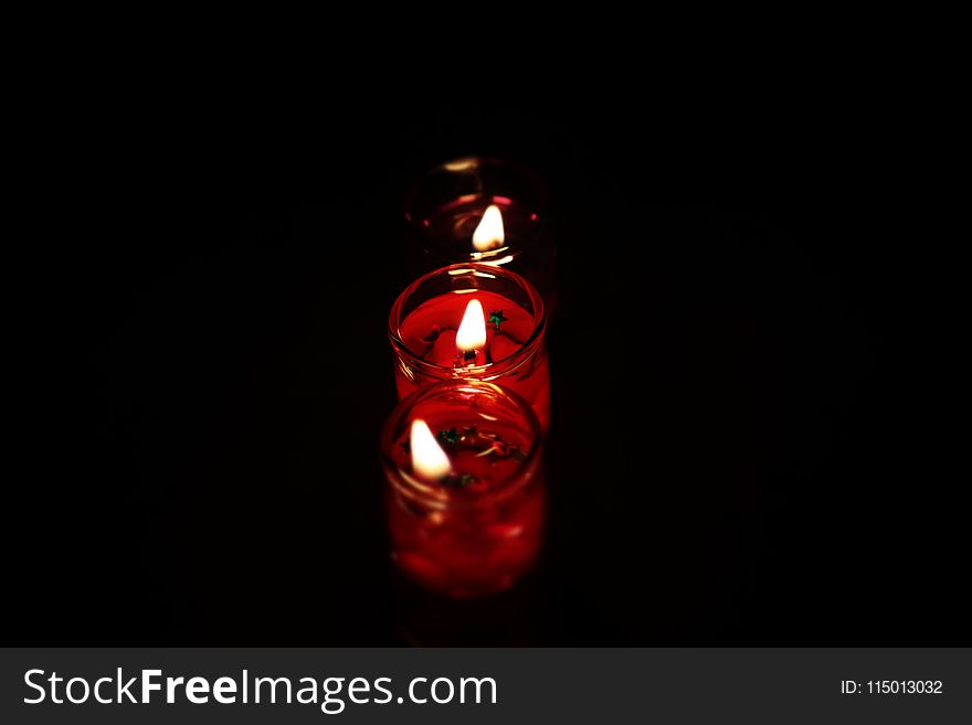 Photography Three Tealight Candles in Dark Place