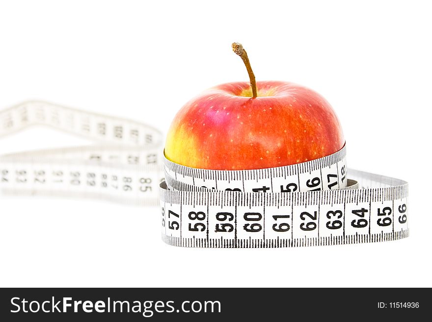 Red apple with measuring tape isolated on white
