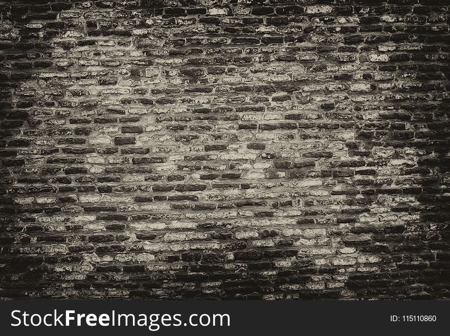 Grayscale Photo of Brickwall