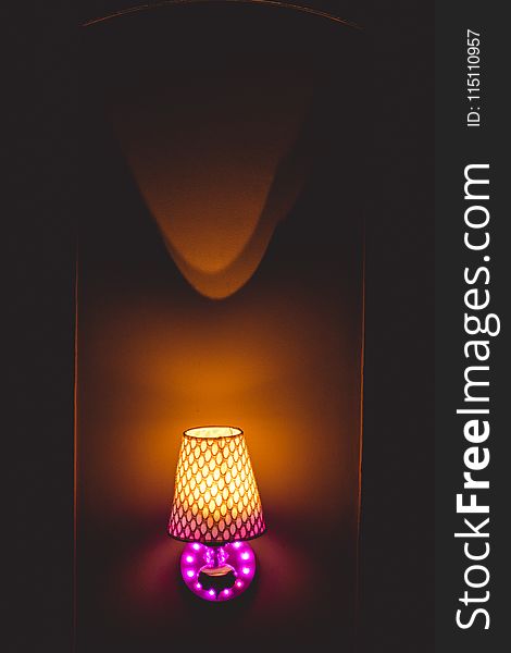 Photo of Yellow and Pink Table Lamp Turned on
