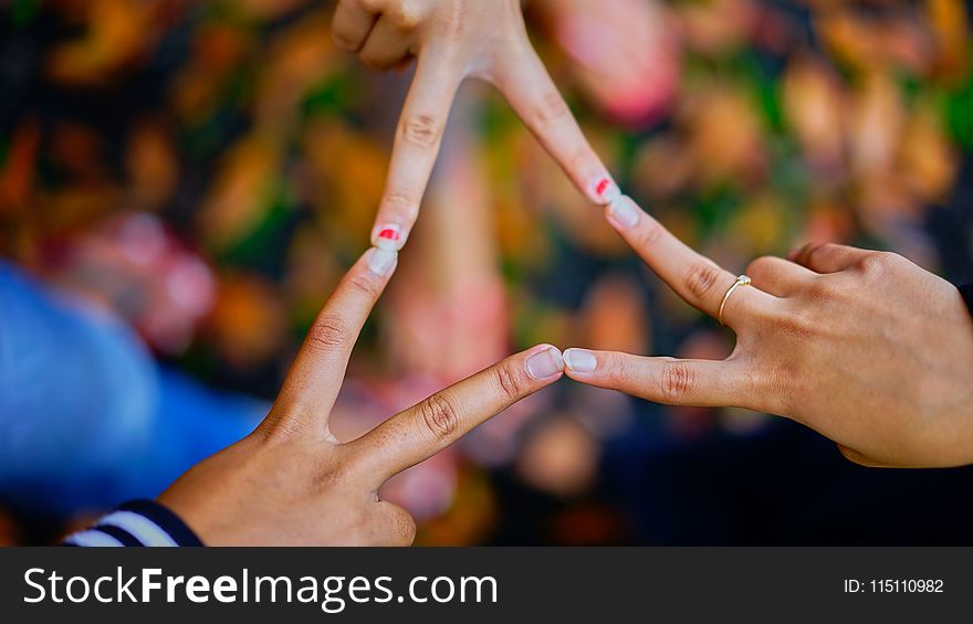 Photography Of People Connecting Their Fingers