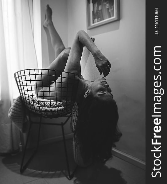 Monochrome Photography Of A Naked Woman Lying On Black Chair