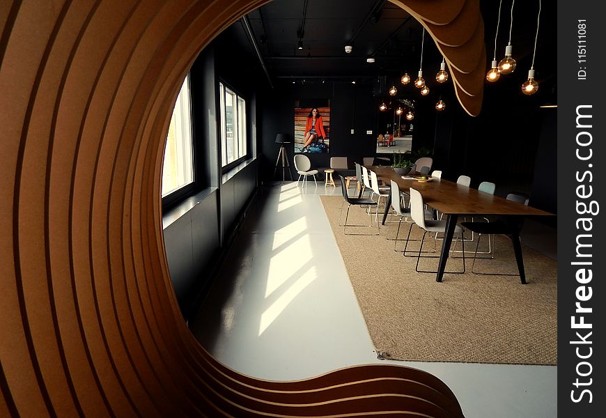 Portrait Photography of Brown Chair Inside a Room