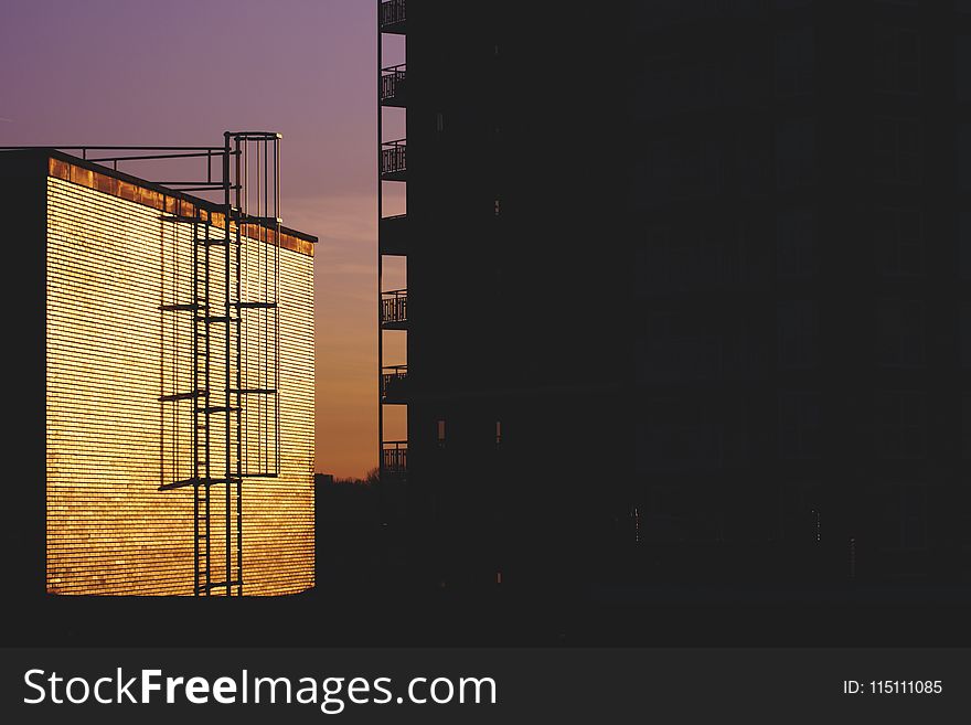 Silhouette of Building during Golden House Photo