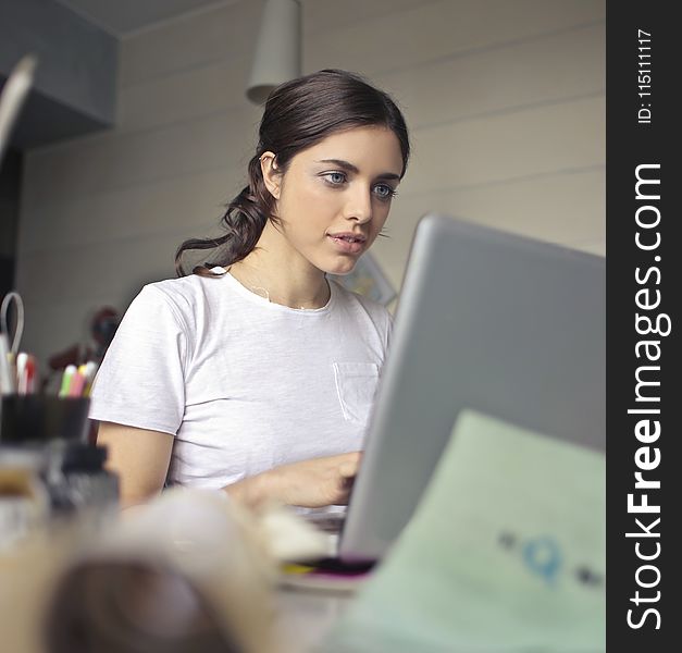 Photography Of A Woman Using Laptop