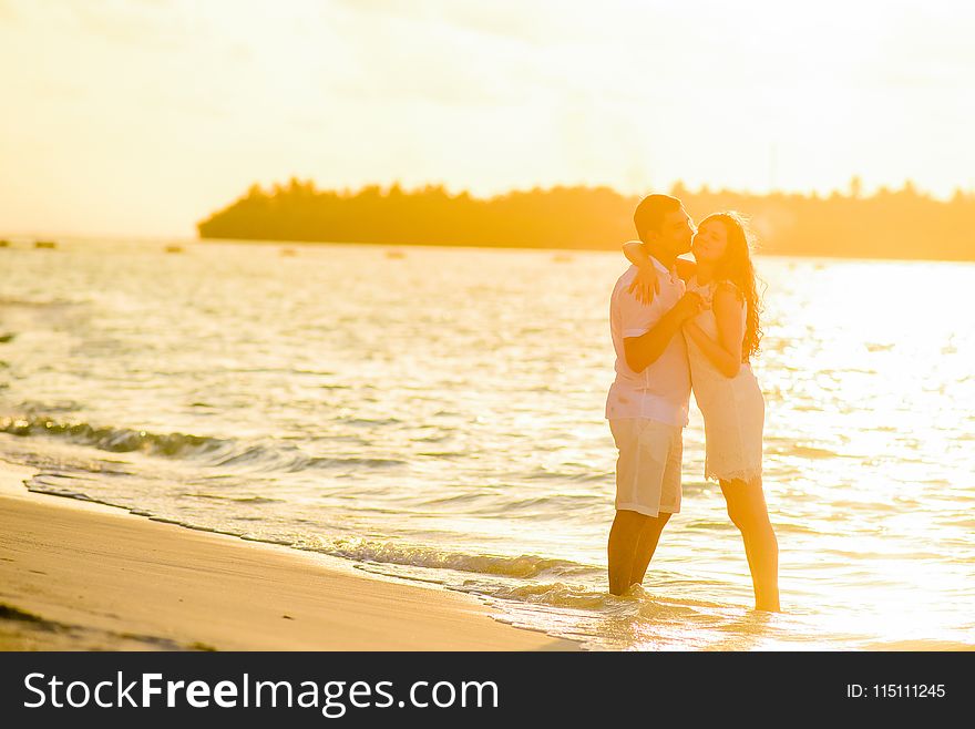 Hugging Woman and Man in Beach