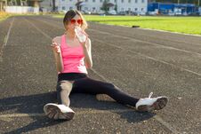 Beautiful Teenage Girl Resting After Workout At Stadium, Drinking Water Stock Photography