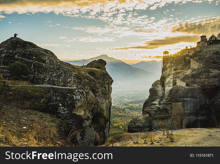 Scenic sunset evening sky over holy Varlaam monastery on cliff in Meteora, Thessaly Greece. Greek destinations. Scenic sunset evening sky over holy Varlaam monastery on cliff in Meteora, Thessaly Greece. Greek destinations