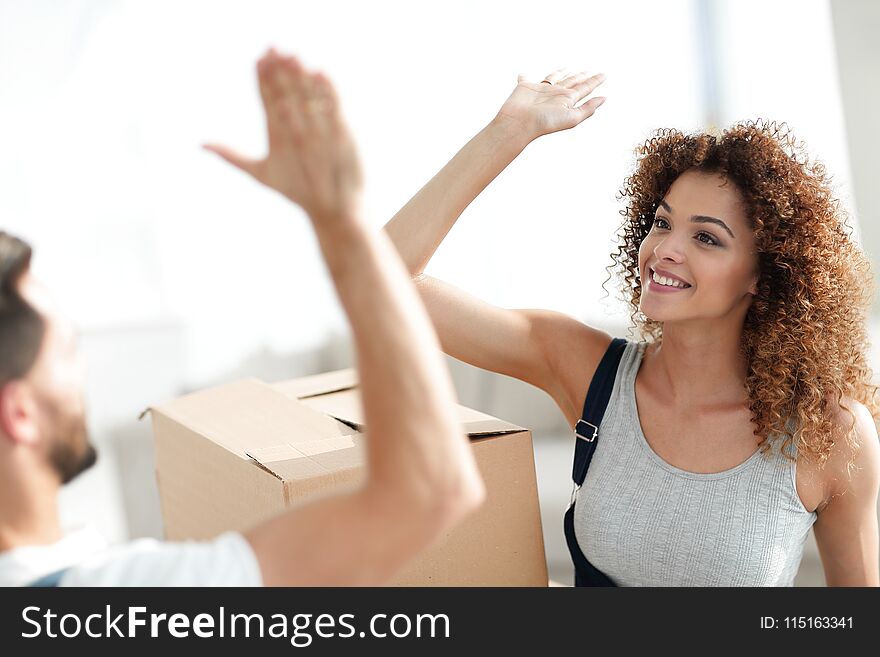 Happy and young couple giving a high five