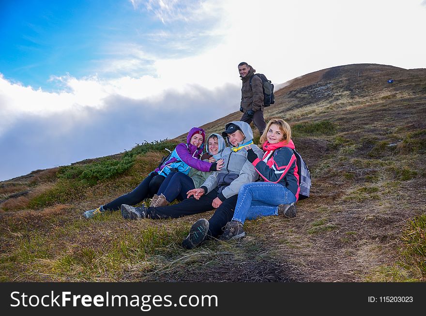 Group of People Hiking Mountain