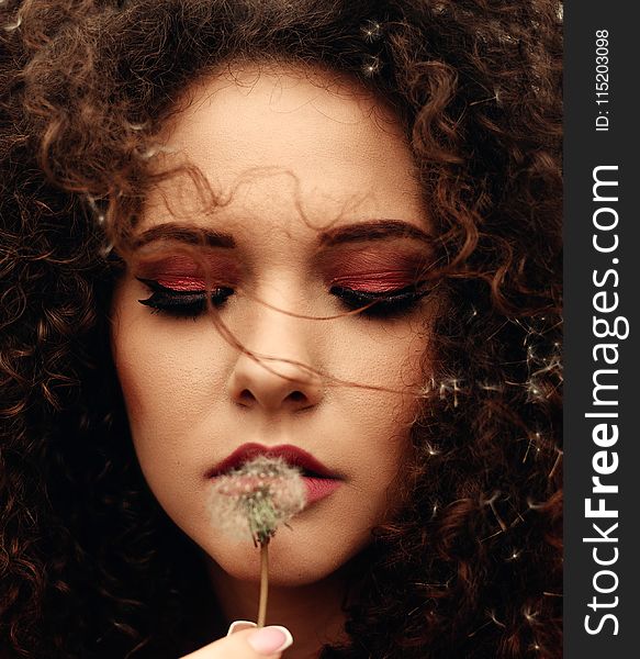 Close-Up Photo of Woman Holding Dandelion Flower