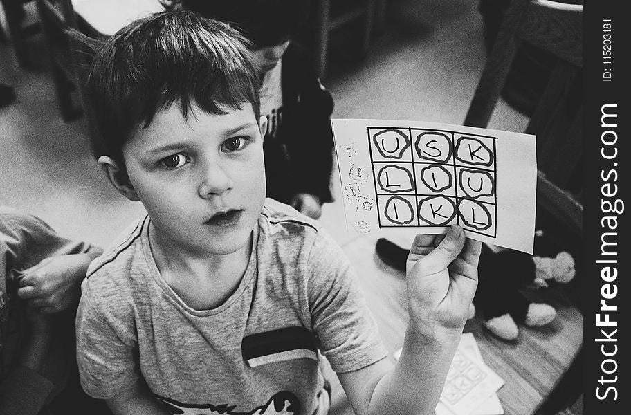 Boy Holding Paper With Text