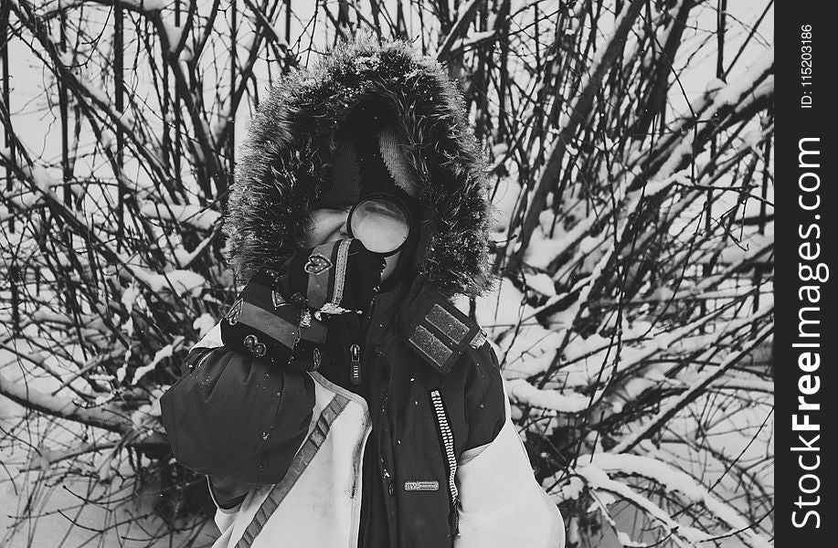 Greyscale Photo of Woman With Snowsuit