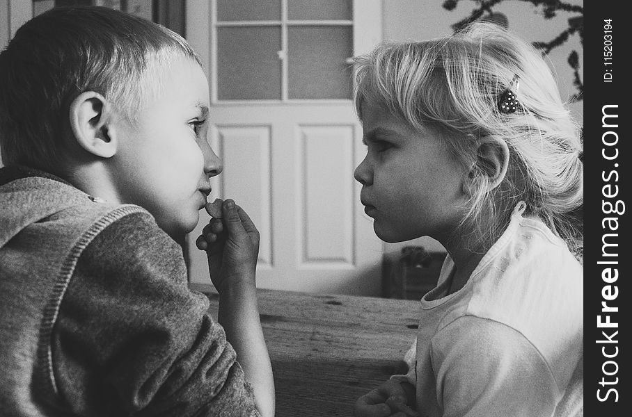 Grayscaled Photo Of Boy And Girl