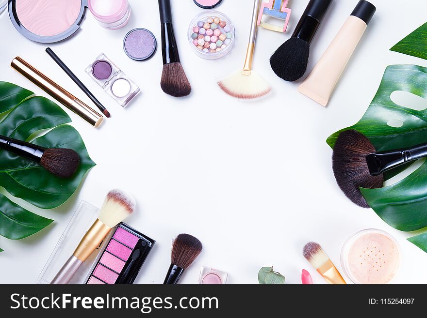 Professional makeup tools with cosmetic beauty products frame , flatlay on white background