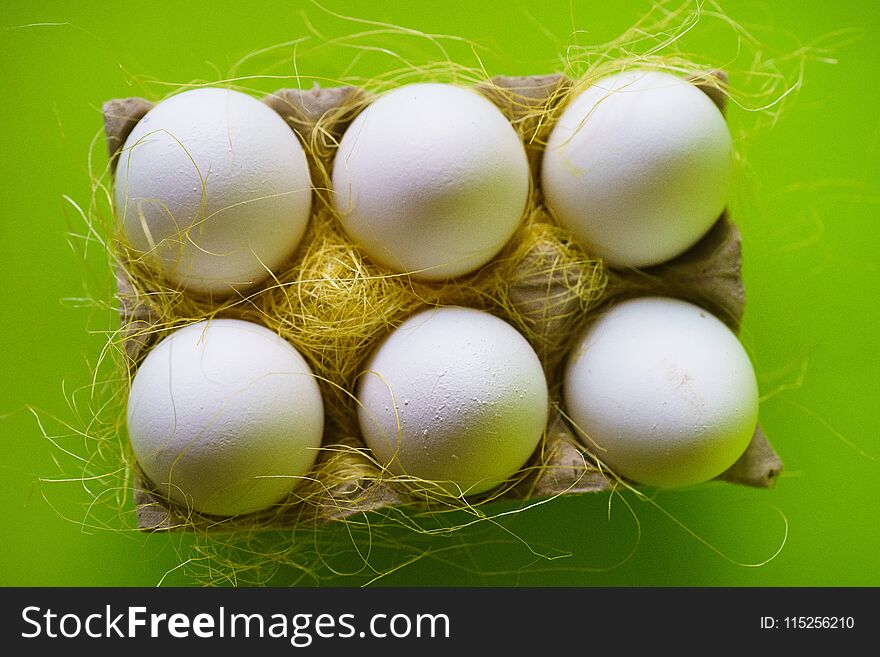 Close-up View of Raw Chicken Eggs in Egg Box