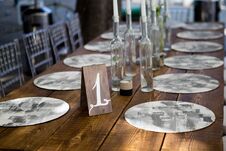 Table With Food And Flowers On The Wedding. Number 1 Written On White Card Stands Before The Bouquet In The Center Of Dinner Table Royalty Free Stock Photography Table With Food And Flowers On The Wedding. Number 1 Written On White Card Stands Before The Bouquet In The Center Of Dinner Table Royalty Free Stock Photography