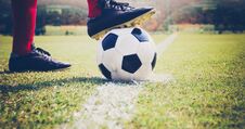 Soccer Or Football Player Standing With Ball On The Field For Kick The Soccer Ball At Football Stadium,Soft Focus Royalty Free Stock Images