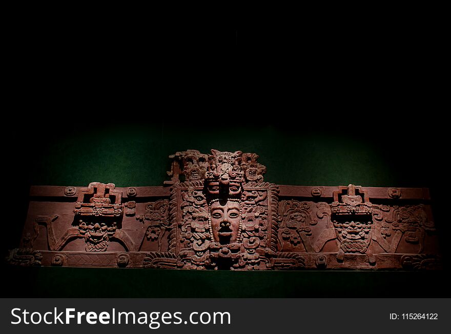 Ancient mayan ornamental face made with clay