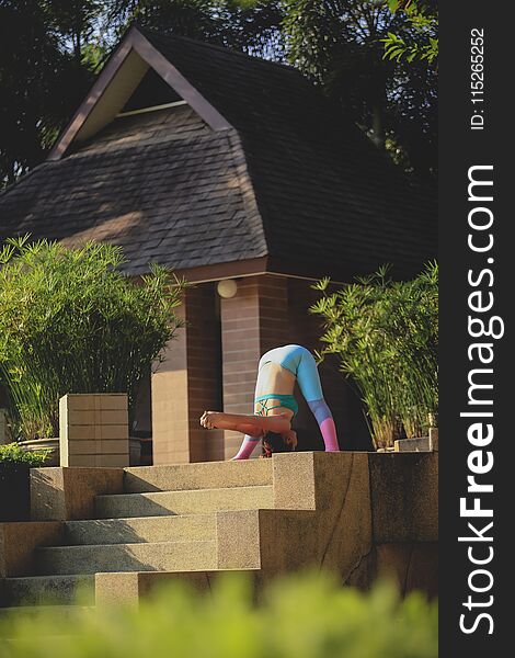 Woman Playing Yoga Outdoor Of Home Terrace