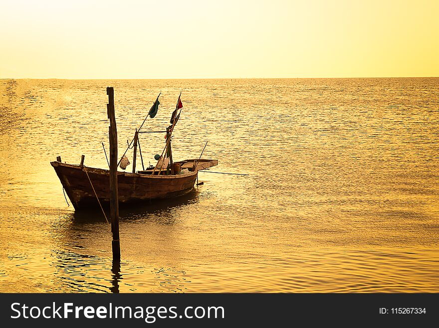 Photo of small fishing boat,sunset