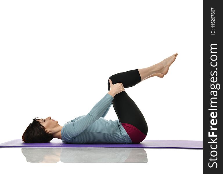 Mother Woman Exercising Doing Postnatal Workout. Female Fitness Instructor Holds Legs In Gym And Workout Exercises