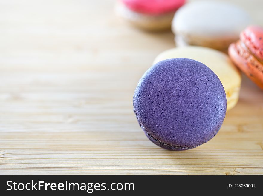 Photo of Macarons on Brown Wooden Surface