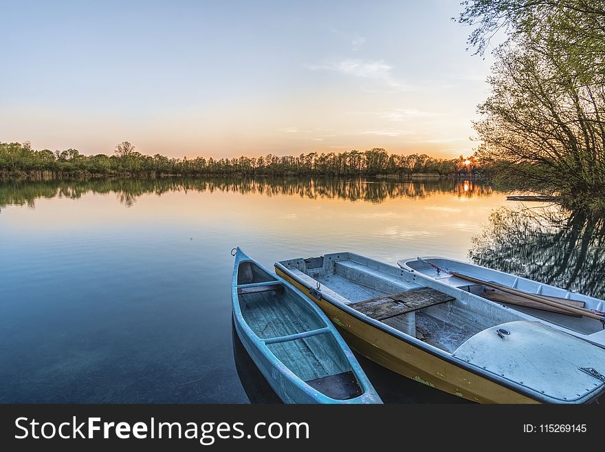 Three Boats On Calm Body Of Water