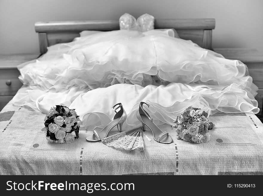 Accesories on a brides bed, waiting for her. Accesories on a brides bed, waiting for her.