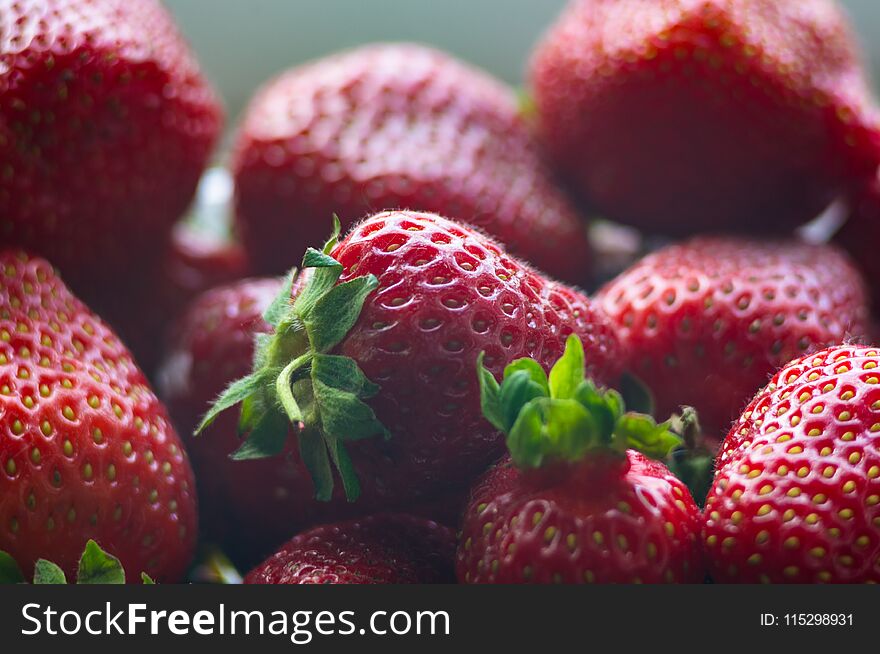 Fresh Ripe Strawberries On Black Ceramic Plate