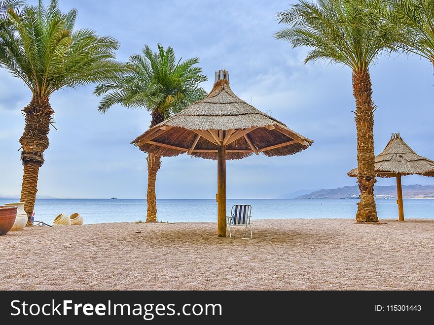 View on the central sand beach of Eilat - famous resort city and southernmost marine port in Israel. View on the central sand beach of Eilat - famous resort city and southernmost marine port in Israel