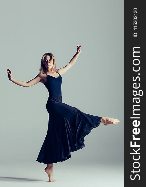 Young beautiful ballet dancer is posing in studio. Young beautiful ballet dancer is posing in studio