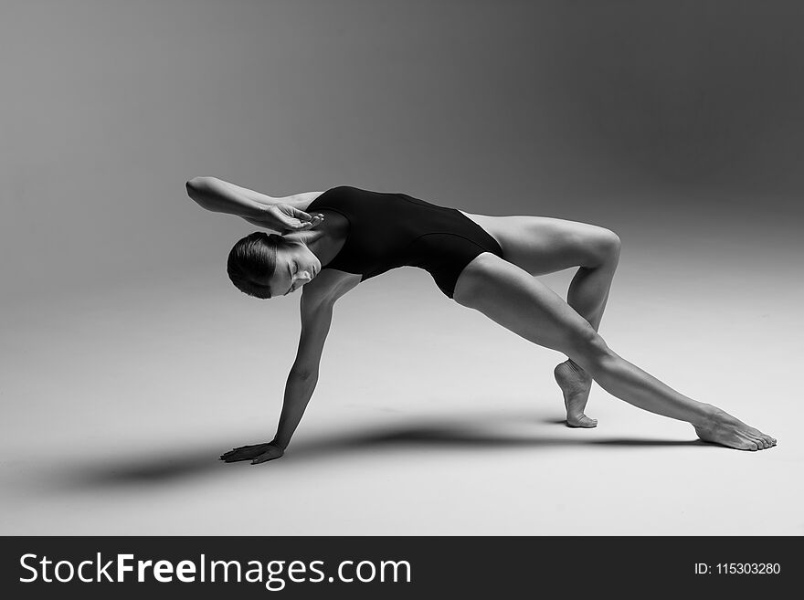 Young beautiful athlete is posing in studio