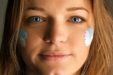 Portrait Of A Woman With The Flag Of The Argentina Painted On Her Face. Stock Photo Portrait Of A Woman With The Flag Of The Argentina Painted On Her Face. Stock Photo